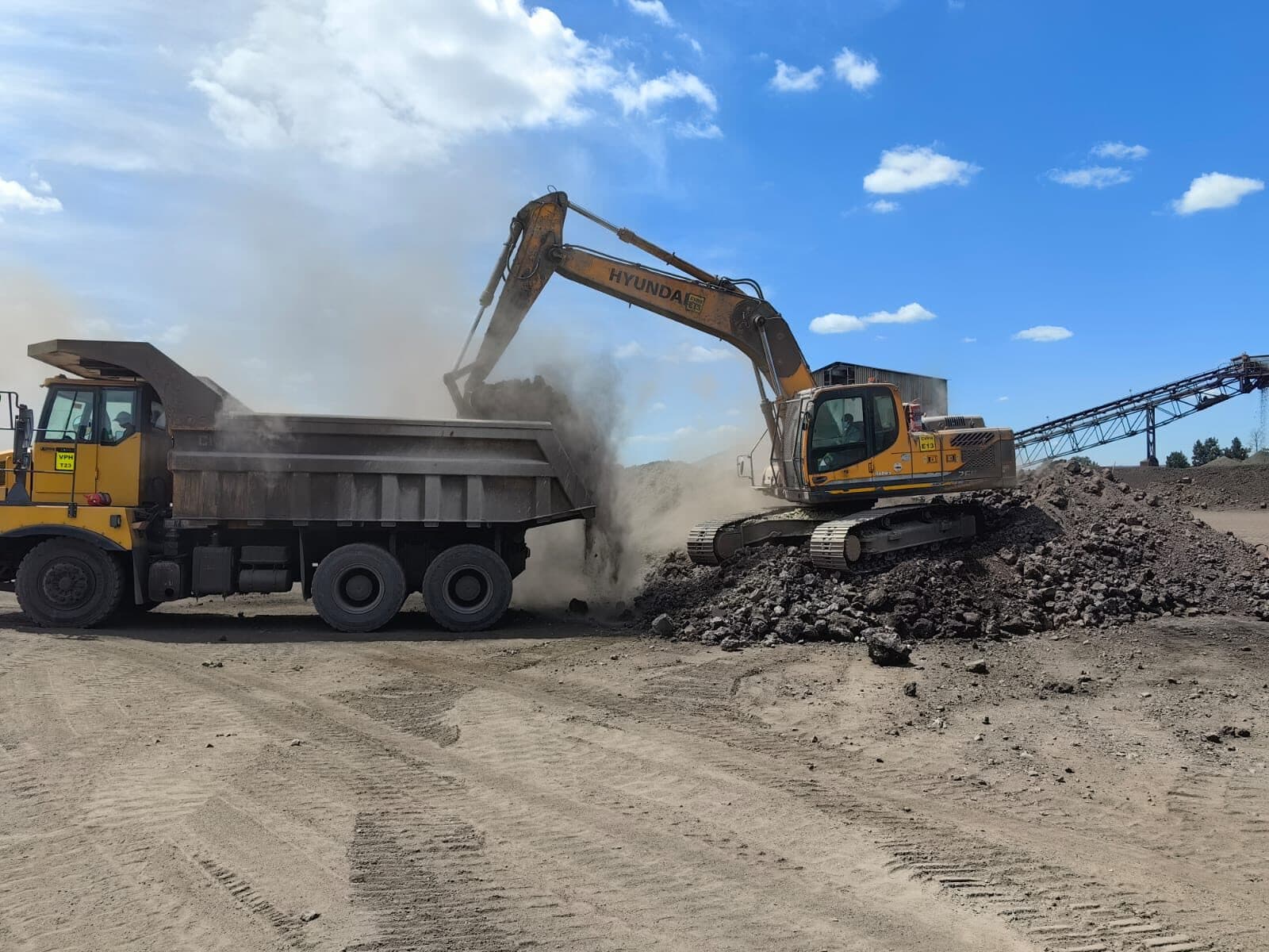 Excavator loading a haul truck